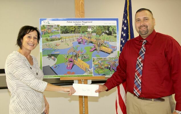 Director Bayless presented a $2500 Check to Mayor Joe Blount