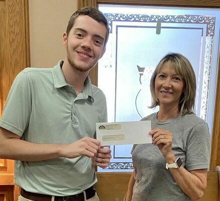 B.S.B. SUPPORTS P.H.S. REUNION- Belgrade State Bank presented their donation to Brenda West with the P.H.S. All School Reunion. Pictured from left is Hunter Ives, B.S.B. Employee and Brenda West. 
(Submitted Photo)