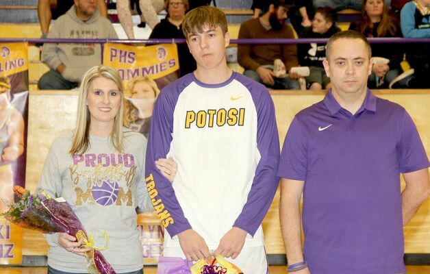 SENIOR NIGHT HONORS – #15 Ian Sansegraw was honored with his parents, Sally and Billy Joe Sansegraw during the festivities. Sansegraw studies construction at Unitec and has played basketball for 3 years.
