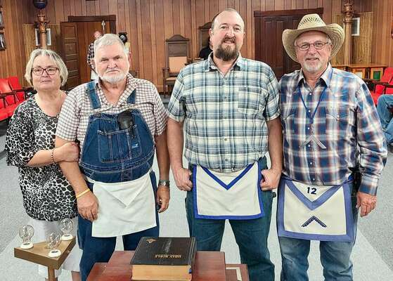 From left, Mrs. Gale (Beverly) Wells, R.W. Brother Gale Wells, R.W. Bro. Randy G. Wells and Tyro Lodge Worshipful Master Joseph Tiefenuer. Brother Gale and Randy joined Tyro after the closure of the Belgrade Lodge.