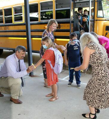 POTOSI R-3’S FIRST DAY BACK – Students seemed ready to get back to school as the youngsters at Potosi R-3 Schools began on Monday, Aug. 23rd. The first day morning went very smoothly with students arriving by bus and as drop offs. Here, students were getting their wristbands with their bus number. Traffic moved well through the Potosi Elementary lot with very few kids seeming too concerned about going to school and what seemed to be more parents having a hard time.